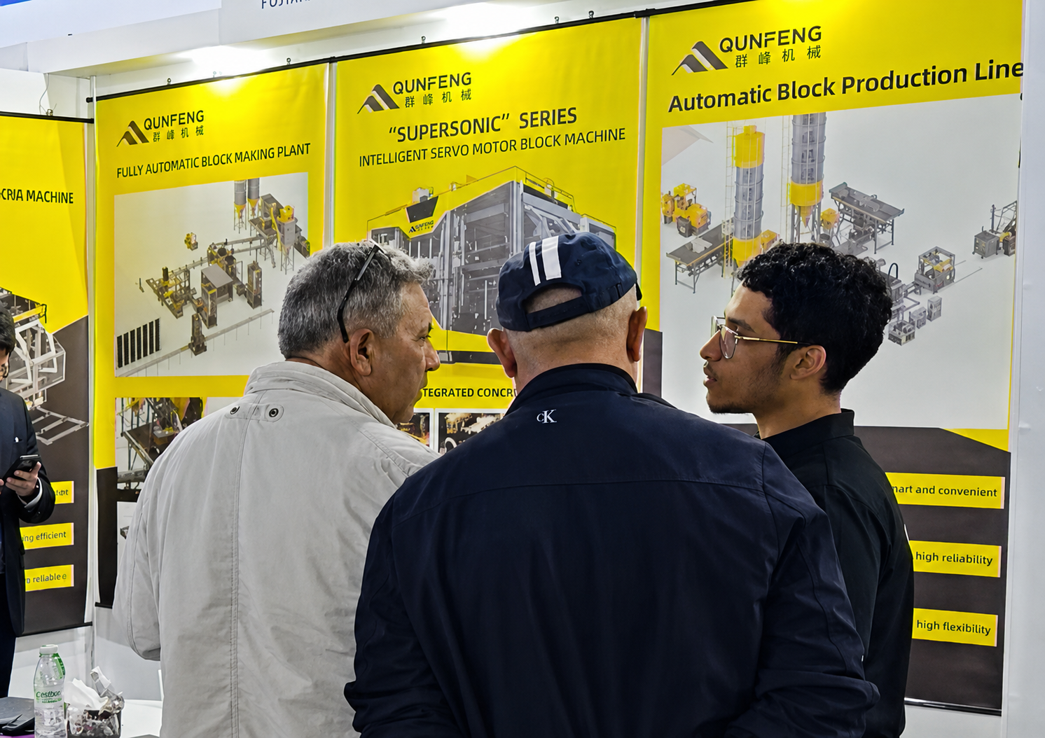 Advanced Building Materials Machinery in North Africa Visitors exploring advanced building materials machinery at the Qunfeng Algeria booth