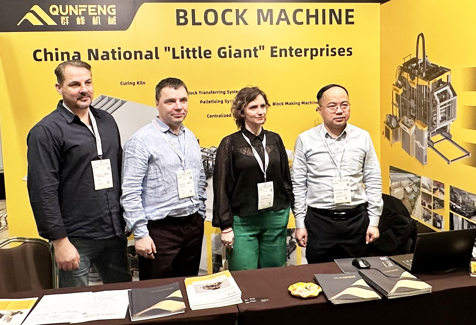 Qunfeng sales team discussing concrete block making solutions with global clients in Europe